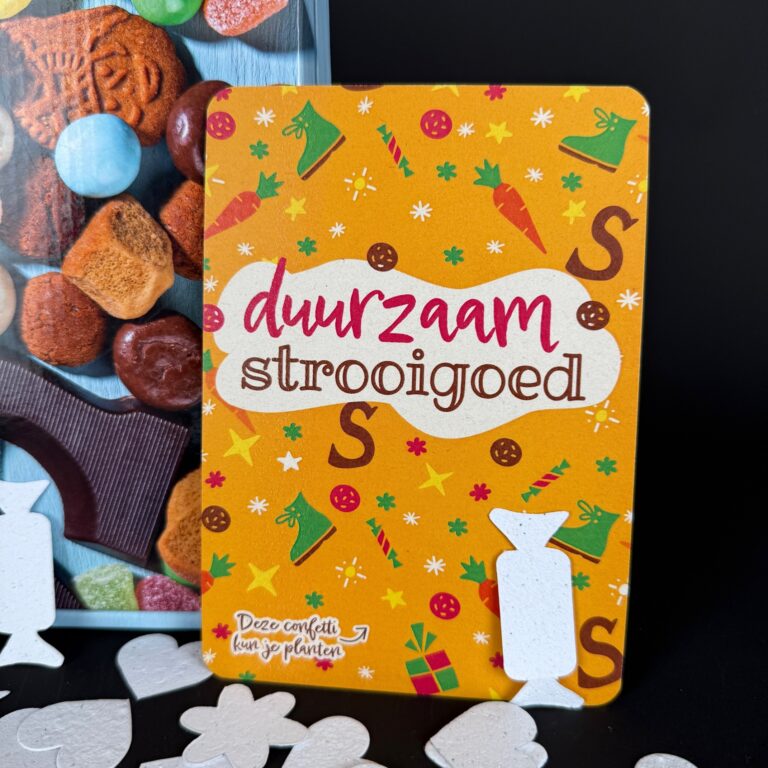 • Strooigoed van zadenpapier in hartvormen naast chocoladeletter